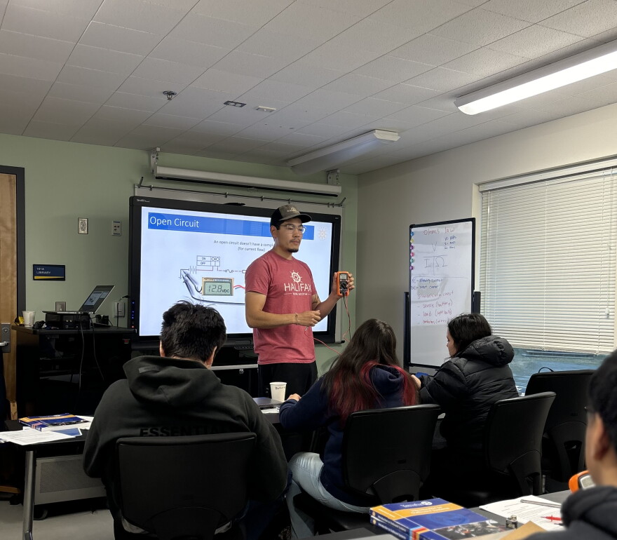 Instructor Triston Chaney teaches Introduction to Outboard Systems class at UAF Bristol Bay Campus's Applied Science Building. 