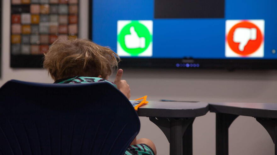 Student thumbs up