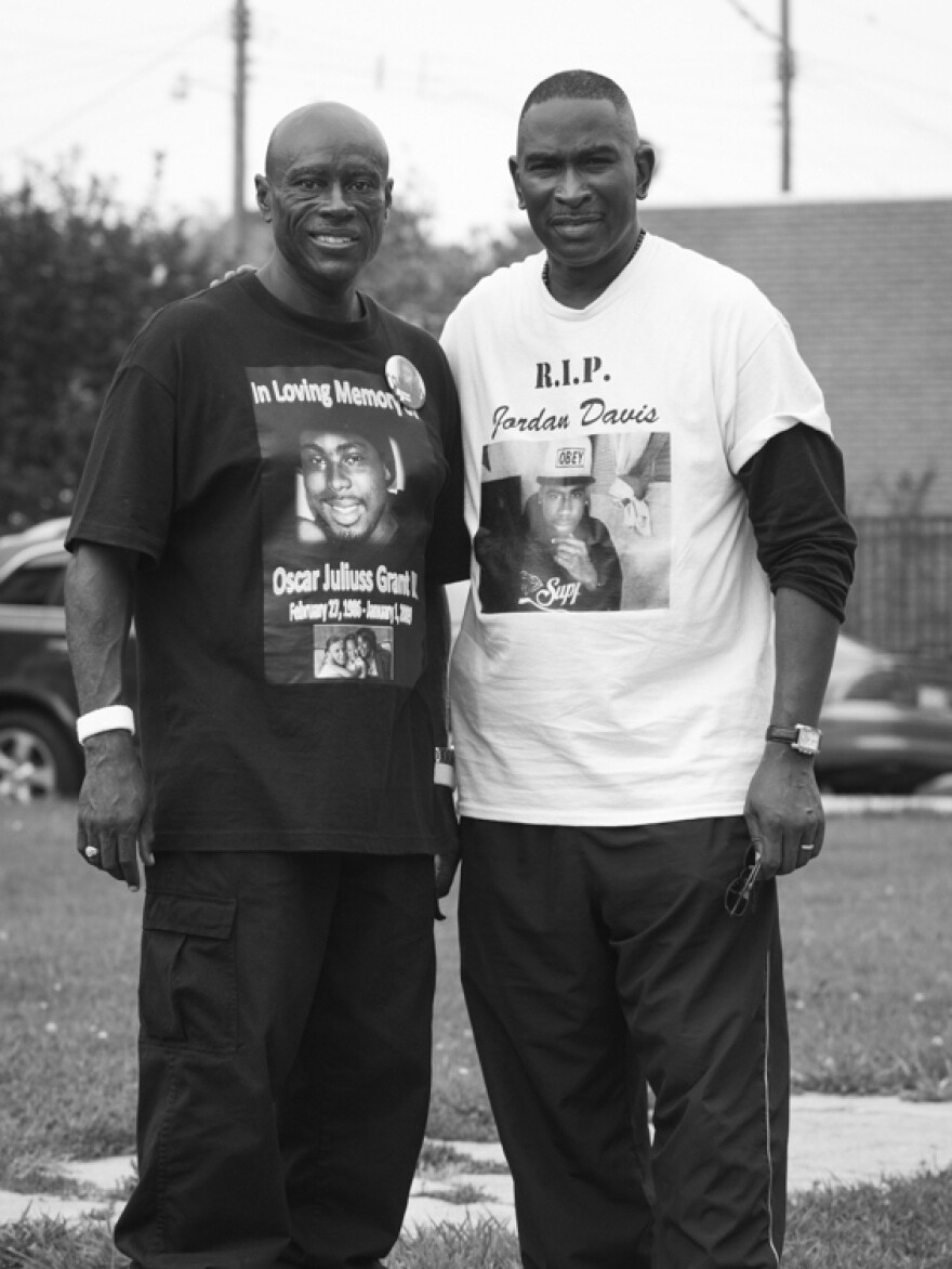 Cephus Johnson (left) is the uncle of Oscar Grant, who was killed in Oakland, Calif., in 2009. He stands in Ferguson with Ron Davis, whose son Jordan was 17 when he was shot and killed in Florida in 2012.