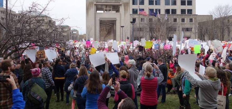 Opponents of new President Donald Trump massed in hundreds of cities, including Indianapolis on Saturday, Jan. 21, 2017