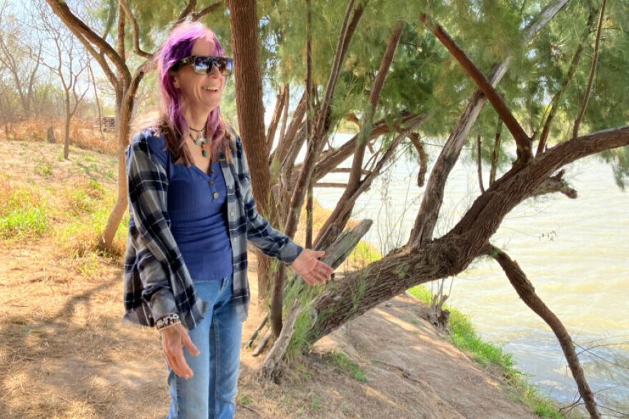 Elsa Hull stands along the Rio Grande in San Ygnacio, Texas, where Customs and Border Protection plans to install cylindrical border buoys.