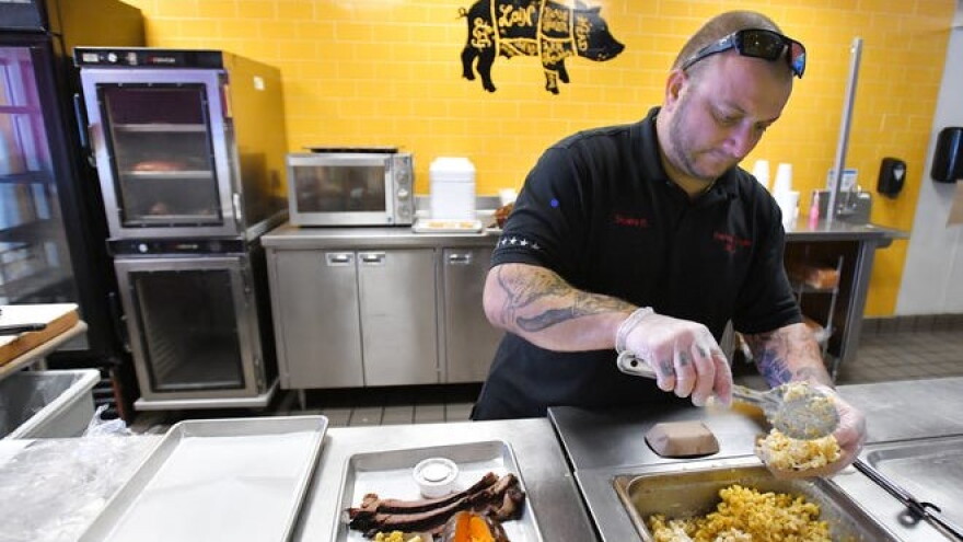 Shaine Berndt, founder and owner of Berndt Ends BBQ in Mandarin, plates meals on a recent Wednesday.
