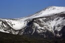 FILE - Tuckerman Ravine is seen at left, about one mile below the summit of 6,288-foot Mount Washington, in New Hampshire, Monday, May 4, 2015. (AP Photo/Robert F. Bukaty, File)