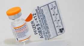 A vial with the Pfizer-BioNTech COVID-19 vaccine for children five to 12 years is seen at The Children's Hospital at Montefiore, Wednesday, Nov. 3, 2021, in the Bronx borough of New York. The U.S. enters a new phase Wednesday in its COVID-19 vaccination campaign, with shots now available to millions of elementary-age children in what health officials hailed as a major breakthrough after more than 18 months of illness, hospitalizations, deaths and disrupted education.