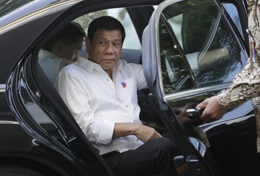 Philippine President Rodrigo Duterte steps out of his limousine upon arrival at Merdeka Palace to meet Indonesian counterpart Joko Widodo in Jakarta, Indonesia, Friday, Sept. 9, 2016.