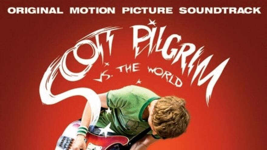 Scott Pilgrim plays an electric guitar.