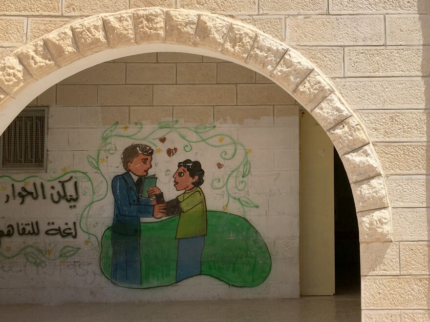 A mural on the wall of the boys' high school in Sair, a Palestinian town in the West Bank. More than a dozen young men from Sair were killed by Israeli forces since last fall, including during attacks on Israelis.