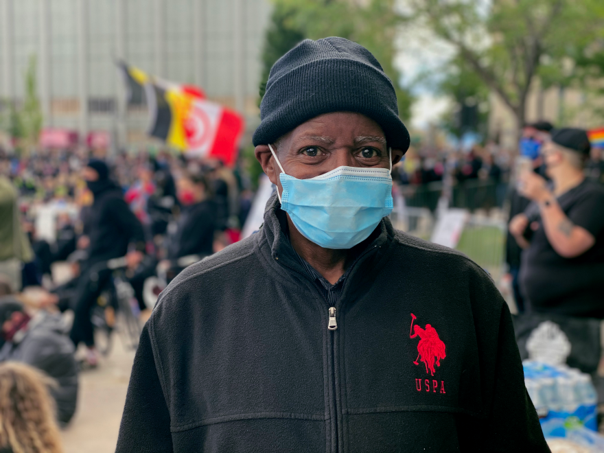 A man poses for a photo during the Black Lives Matter protest.