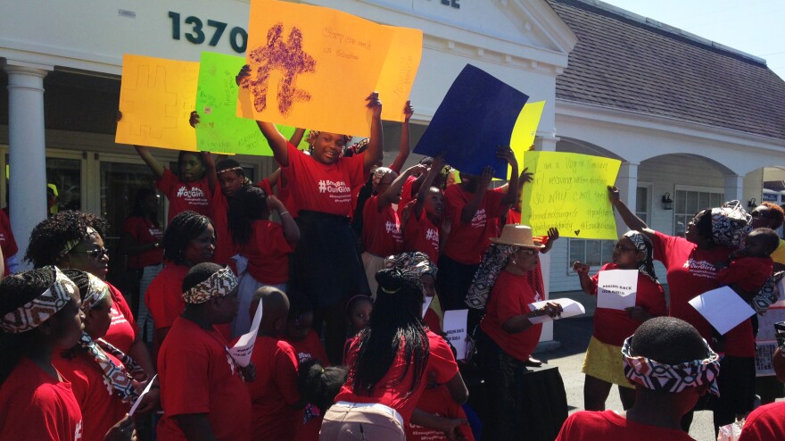 In Bowie, Md., girls raise their signs in protest of the Nigerian government's fruitless search efforts, and in solidarity with the schoolgirls still missing.