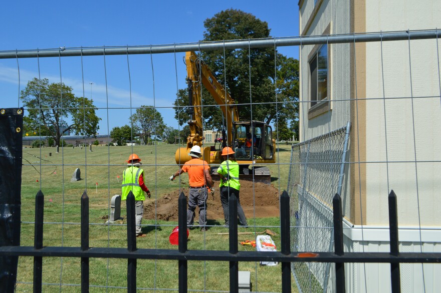 An excavation team at Oaklawn Cemetery, part of the city's 1921 Graves search, in September 2023.