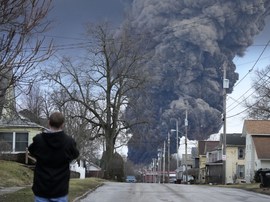 A black plume rises over East Palestine, Ohio, as a result of a controlled detonation on Feb. 6 of a portion of the derailed Norfolk Southern trains.