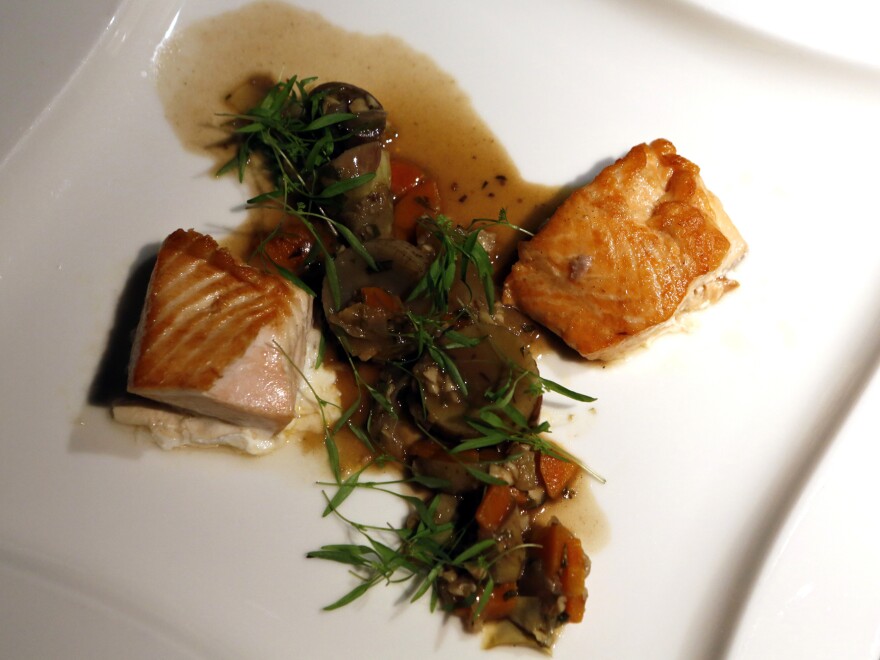 Wild Alaskan king salmon, at left, with farm-raised salmon, right, are served at a dinner at the National Aquarium in Washington, D.C.