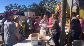 Eastpoint residents enjoy a barbeque at the Big Top Supermarket after Hurricane Michael (10/12/2018)