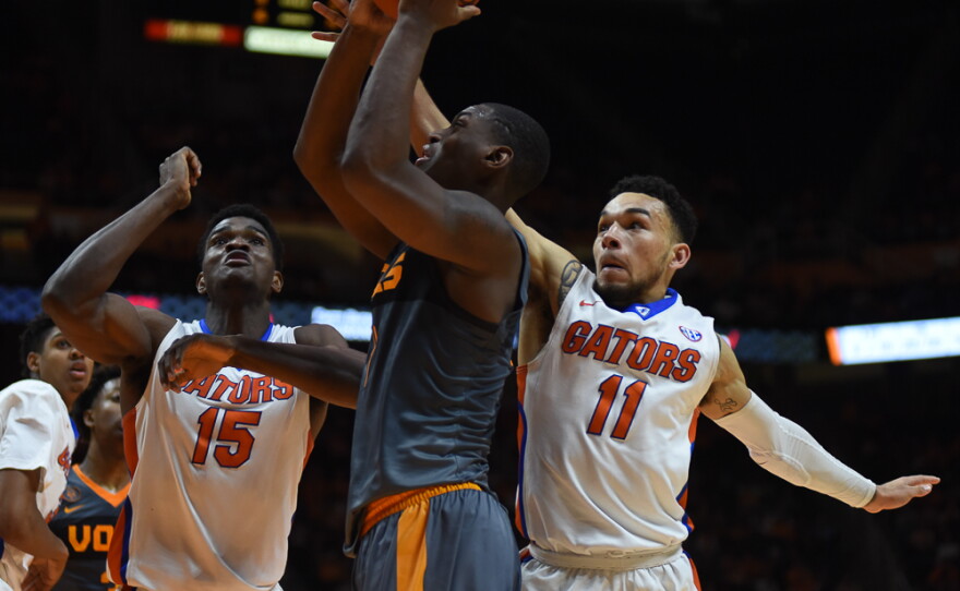 While going up for a shot in the second half, Tennessee's Armani Moore is fouled by Florida's Chris Chiozza (11). (Greenberry Taylor/WUFT News)
