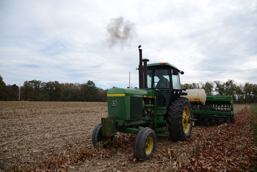 Brian Willott prepares the soil for planting cover crops by pressing down stalks of corn, the previous crop, to help it better decompose on Nov. 3 at his farm in Laddonia.