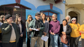 Antonio Díaz from PODER SF in front of a Bryant St. apartment building that has been converted to all electric power as part of the group's environmental justice work.