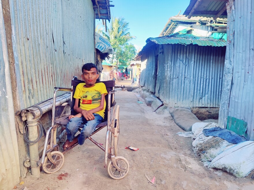 A Rohingya man in his wheelchair. "We think that photography and storytelling have that power to motivate people and to draw their attention to our crisis," says photographer Mohammed Salim Khan.