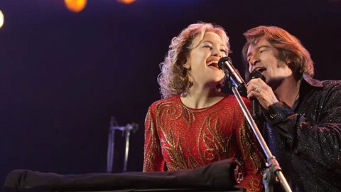 (L to R) Kate Hudson as Claire Sardina and Hugh Jackman as Mike Sardina in director Craig Brewer's Song Sung Blue