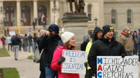 People protest against excessive quarantine amid the coronavirus pandemic at the Michigan State Capitol in Lansing, Michigan.