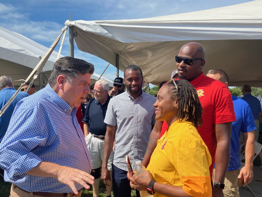 Illinois Gov. JB Pritzker meets Shavonne Singleton of Rock Island and her husband Demetriyone at the annual Rock Island County Democrats' Salute to Labor picnic in East Moline, Monday, Sept. 7, 2026.