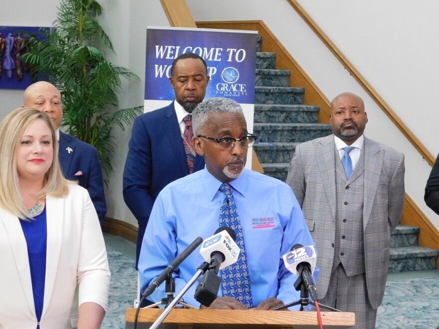  "People trust the church," says Dexter Clarke (at podium), Genesee Health Service
