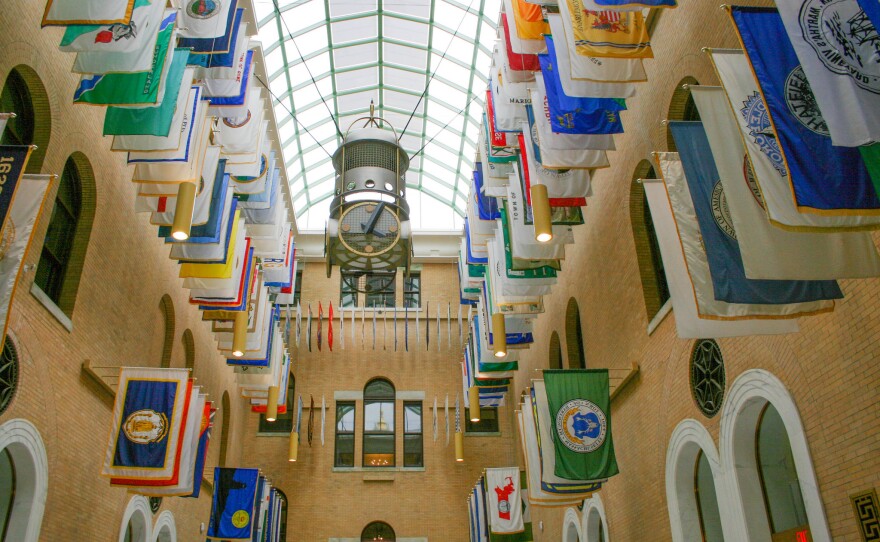 The Great Hall in the Massachusetts Statehouse, featuring town flags.
