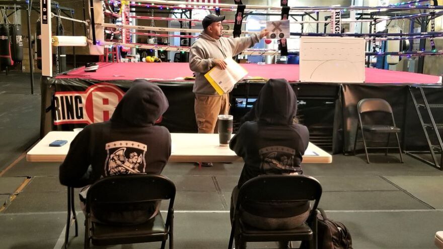 Kansas City, Kansas, police officer Joey Reyes helps teenagers avoid tickets by teaching driver education. 