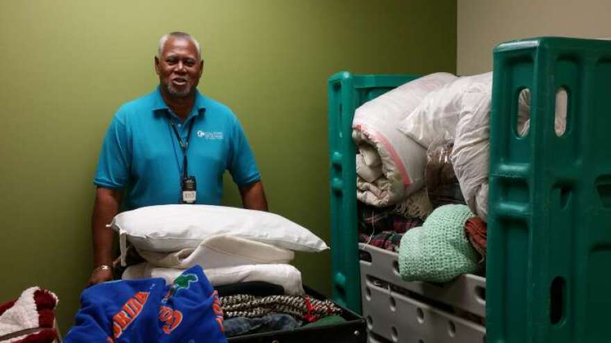 Staff and residents sort items donated by the community to keep the area's homeless warm. Photo: Central Florida Coalition for the Homeless.