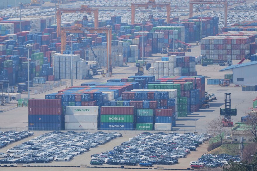 Vehicles, cranes and shipping containers are seen at a port in Pyeongtaek, South Korea, Tuesday, April 15, 2025. (AP Photo/Lee Jin-man)