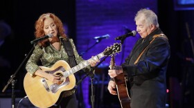 Bonnie Raitt, left, and John Prine perform during the Americana Honors & Awards show Wednesday, Sept. 11, 2019, in Nashville, Tenn. (AP Photo/Wade Payne)