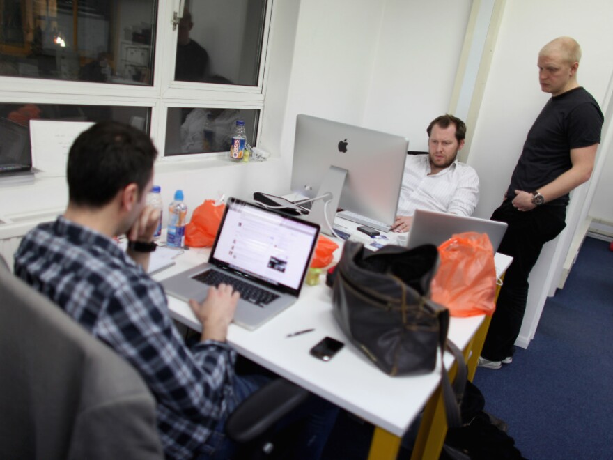 Small startup companies have an advantage, says author Eric Ries: they can test innovative ideas quickly. Here, workers in London talk at TechHub, an office space for technology entrepreneurs.