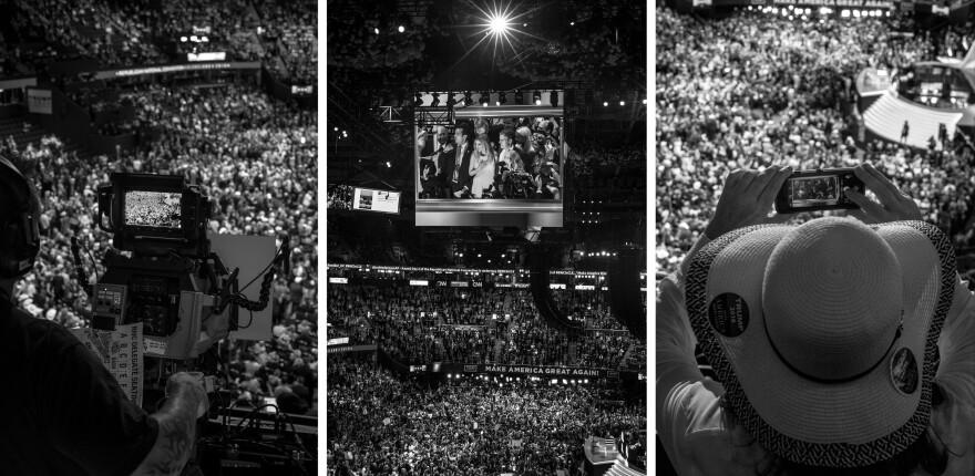 Attendees take in Wednesday evening's program at the convention hall through different screens.