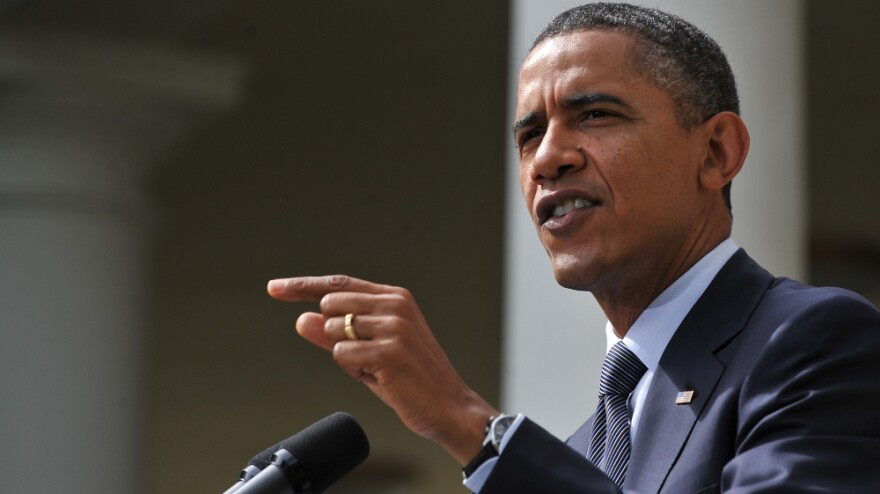 President Obama speaks in the Rose Garden at the White House on Monday. Obama laid out a plan for trillions in deficit cuts but warned Republicans he will veto any bill that makes structural changes to Medicare unless they agree to additional revenues.