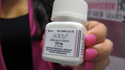 FILE - In this Aug. 18, 2015 file photo, Sprout Pharmaceuticals CEO Cindy Whitehead holds a bottle for the female sex-drive drug Addyi in Raleigh.