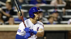 New York Mets' Rafael Ortega hits a three-RBI single against the Atlanta Braves during the fifth inning of a baseball game Sunday, Aug. 13, 2023, in New York. (AP Photo/Adam Hunger)