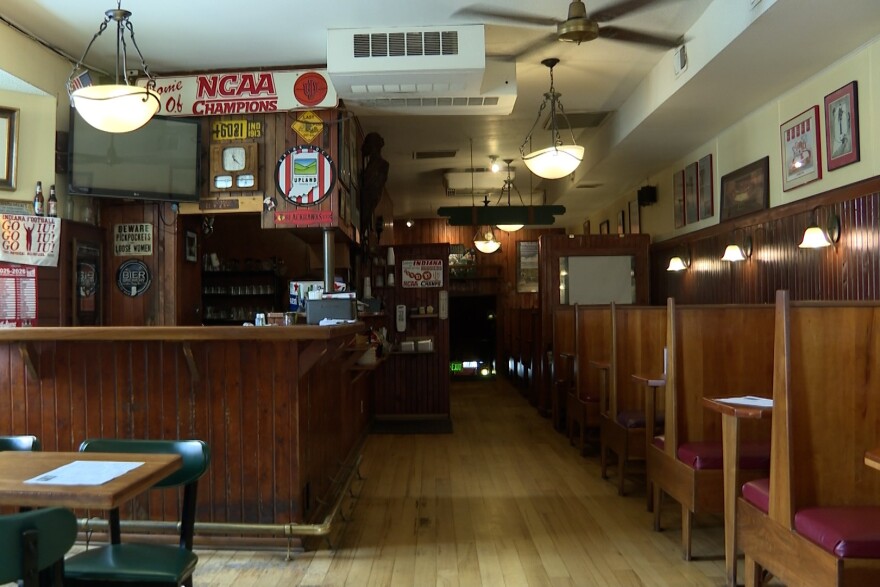 Interior of a bar with wooden booths and IU memorabilia