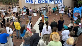 Protesters gather outside the New Mexico Environment Department to voice opposition to the Project Jupiter data center during a demonstration in Santa Fe, N.M., Friday, Aug. 21, 2026.
