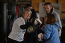 Judy Talerico and Joe Lapinski take turns working out with Coach Kathy Reap at Rock Steady Boxing gym in Old Forge.