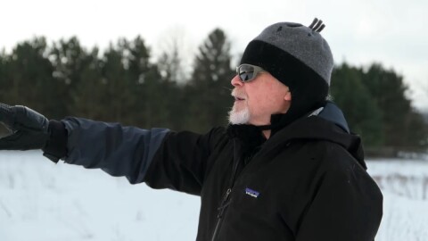 David Weeks looks out over his farmland in Cedar. (Photo: Miles MacClure / Northern Michigan Journalism Collaborative)