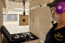 Carl Simons, a member of the Falmouth Rod & Gun Club, reviews a target at the club's indoor shooting range.