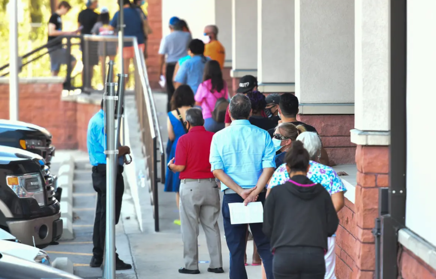 Voters waited outside of the Bexar County Elections Department in San Antonio to drop off their mail-in ballots, voter registration applications or be trained as poll workers on Oct. 5.
