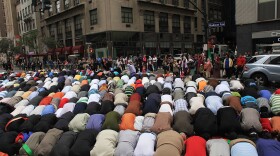 Men pray on the street before the start of the American Muslim Day Parade in 2010 in New York.