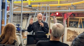 Reinforcing the literature/science link, award winning author Robert Olen Butler did a book reading amidst some of the world's most advanced scientific apparatus/