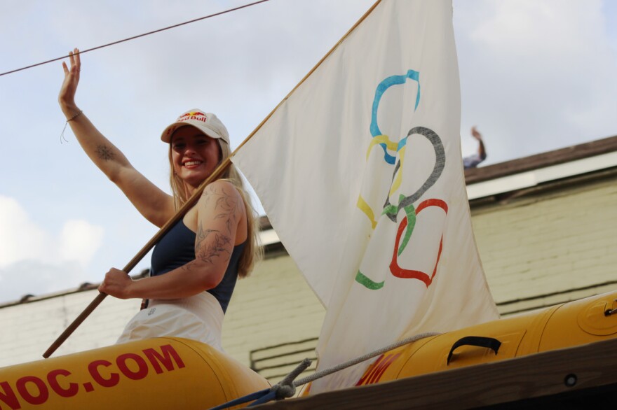 Olympic bronze medalist Evy Leibfarth received a warm welcome home with a Homecoming Celebration in Bryson City Wednesday evening, Aug. 14. Evy and her parents Jean and Lee Leibfarth rode in a raft on top of a Nantahala Outdoor Center bus through Main Street and a section of Everett Street to cheering crowds waving American flags.