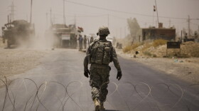 The release of hundreds of thousands of "action reports" by the WikiLeaks website offers a new level of detail about the U.S. occupation of Iraq. Here, a U.S. soldier walks through a checkpoint set up after a car bomb attack killed two U.S. soldiers in  Diyala Province, June 11, 2010.