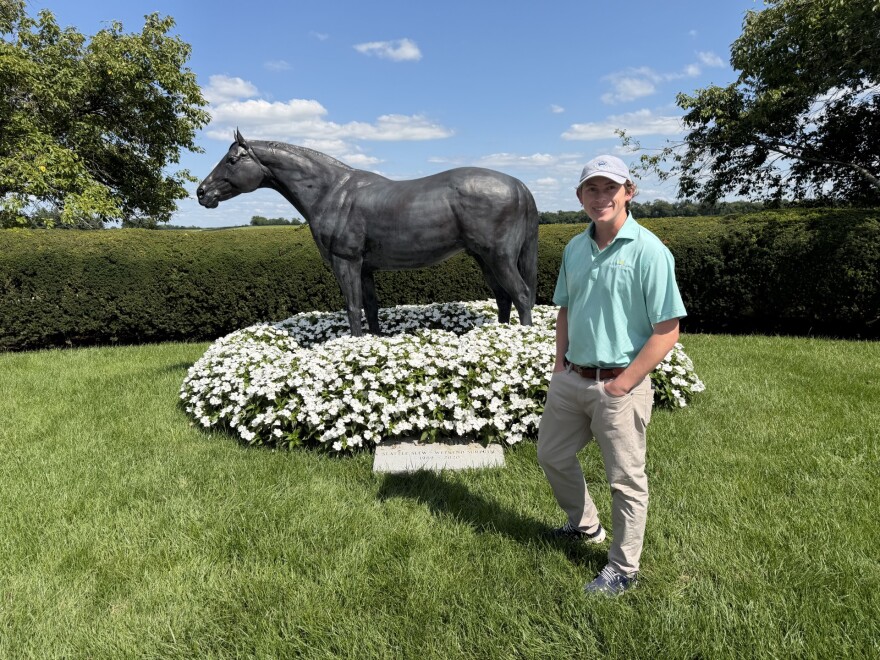 Lane's End's Will Farish stands in front of the AP Indy statue on the farm
