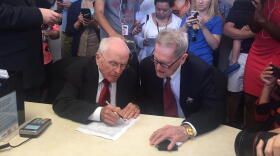 George Harris (left) and Jack Evans (right) signed their marriage license June 26 in Dallas. They have been together for more than 50 years.