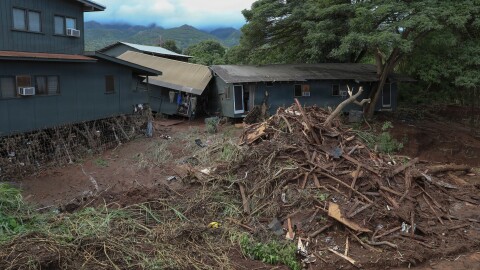 A damaged home sits among flood debris in Waialua, Hawaiʻi, on March 23, 2026.