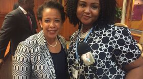 An image of a youth radio reporter and US Attorney General Loretta Lynch