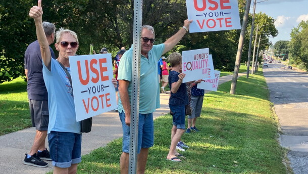 Protestors against the federal SAVE Act line Brady Street at Vander Veer Park, on Aug. 26, 2026.
